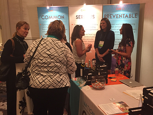 2016 CMV Conference Reception, gathering around the National CMV Foundation exhibit