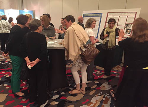 2016 CMV Conference Reception, attendees networking and discussing posters