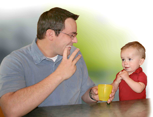 a father signing the word water with his young son